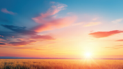 Fototapeta premium Beautiful sunset over golden field, showcasing vibrant colors in sky and serene landscape. warm hues evoke sense of peace and tranquility