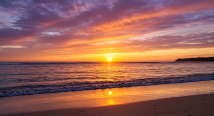 Vibrant sunset over ocean with colorful sky reflecting on wet sand