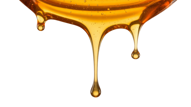 Golden honey dripping, creating sweet, viscous, liquid textures for culinary use