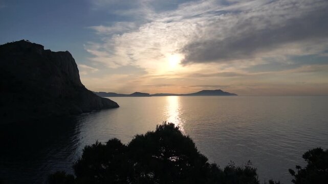 Sunrise morning view of the ocean with mountains in the background. New world view of the sea and mountains from Cape Kapchik