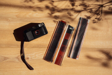 Retro 90s Film Photography Aesthetic with Analog Camera and Negative Strips