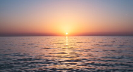 Naklejka premium Tranquil sunset over calm ocean water horizon with golden light
