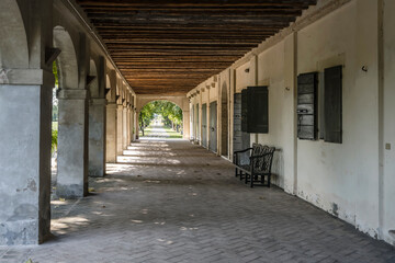under covered walkway at colonnade of Foscari manor house  on Brenta canal, Mira, Italy