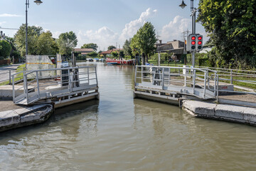 Fototapeta premium lock doors closing on Brenta canal, near Marghera, Italy