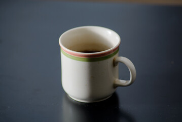 A cup of freshly brewed strong and black homemade coffee for a good mood