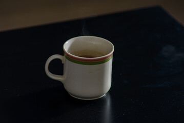 A cup of freshly brewed strong and black homemade coffee for a good mood