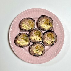 Delicious kimbap rolls filled with fresh vegetables, seasoned rice, and savory proteins, all wrapped in crisp seaweed. A perfect combination of flavor and texture in every bite.