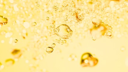 Golden bubbles in a vibrant liquid create a refreshing and dynamic feeling perfect for product visuals