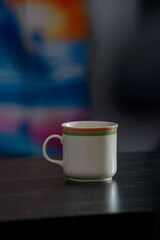 A cup of freshly brewed strong and black homemade coffee for a good mood