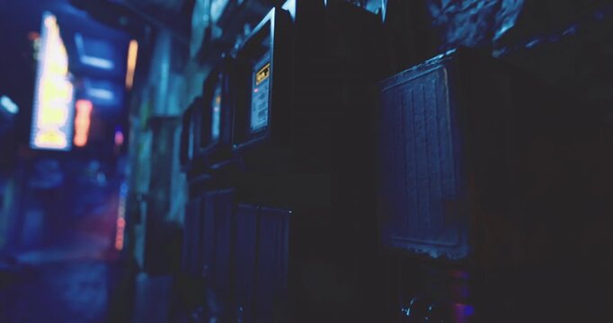 A narrow alleyway at night showcases a row of illuminated mailboxes against a backdrop of vibrant neon lights. The atmosphere is mysterious and urban.