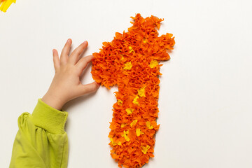 Educational kids activity: number one made of cardboard, covered with plasticine and decorated with textured paper squares. Creative DIY craft for preschool, kindergarten or birthday decor.