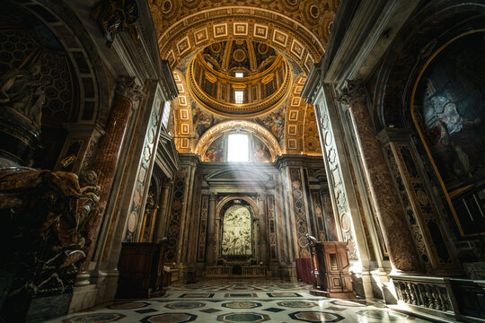 Interior of St. Peter&rsquo;s Basilica with Sunlight Streaming Through a Window, Vatican City - Rome, Italy
