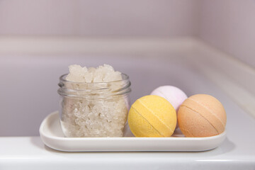 A set of bath salts and bombs on a tray in the bathroom