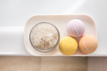 A set of bath salts and bombs on a tray in the bathroom