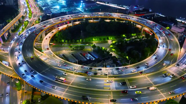The iconic Nanpu Bridge features distinctive spiral approach ramps, connecting traffic across the Huangpu River. This architectural landmark is a vital part of Shanghai's urban infrastructure, China.