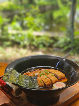 Tonkatsu Udon, Deep fried pork cutlet serving on the clear soup with Japanese big noodle