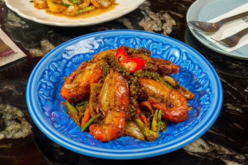 Vibrant Thai Prawn and Bell Pepper Stir-fry on a Blue Plate