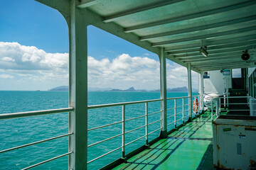 Colourful interior of ferry. The Thai flag flutters on the bow of the ferry crossing to Samui and Koh Phangan. Scenery view. Boat Deck Of A Passenger Ship. Ocean view from Ferryboat.