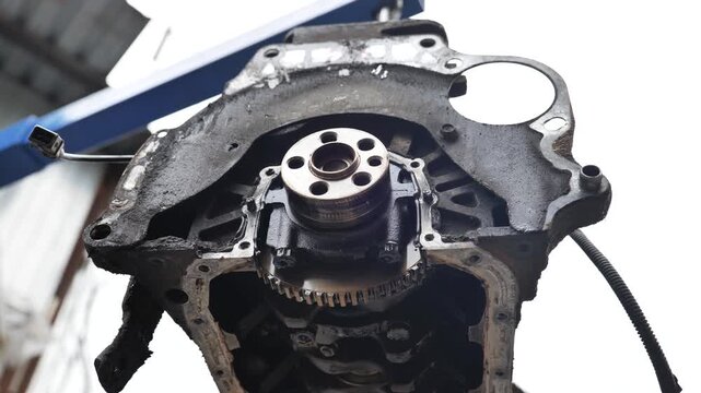 Car engine block undergoing repair at service station