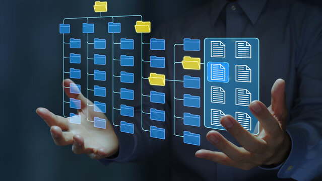 Document control and archive system. Document and record management. Business person holding file icon on folder structure.