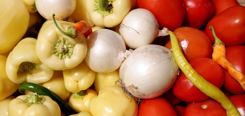 Closeup of vibrant freshly harvested organic produce at farmers market. Locally grown fruits and vegetables with bio products.