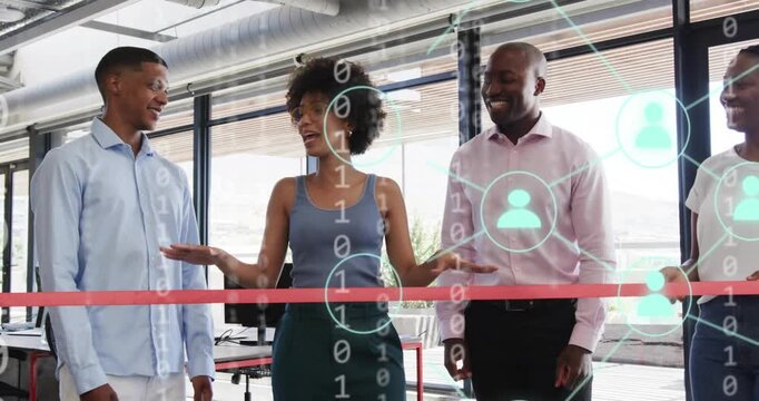 Speaker stepping initiating code overlay as team celebrating ribbon cutting with tech network nodes