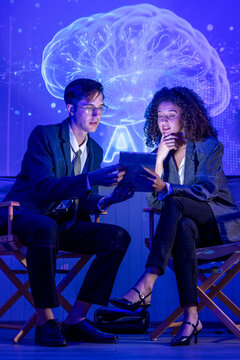 Seminar woman with man in conversation for ai governance, machine learning, Presenter promoting artificial intelligence solutions, Strategy plan to executive write prompt AI bot IT app program.