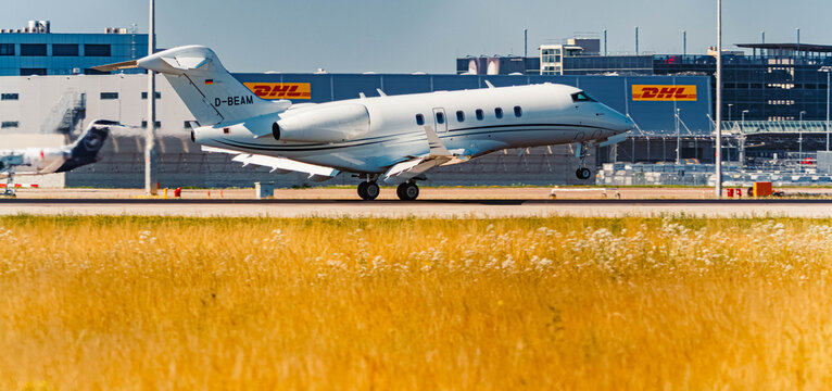 D-BEAM, Bombardier Challenger 300, DAS Private Jets passenger jet airplane touchdown on a sunny summer day at Munich airport, MUC, Freising, Bavaria, Germany