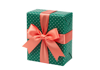 Green polka dot gift box with coral ribbon isolated, present for Christmas or birthday celebration on a clean backdrop