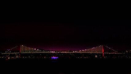 Fototapeta premium Bosphorus Bridge at Night, Linking Two Continents