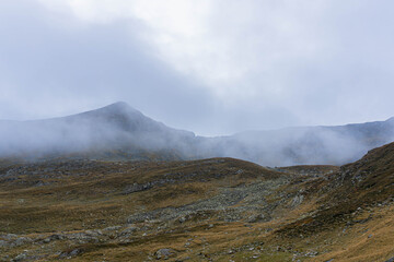 mountain landscape with clouds hidden peaks 