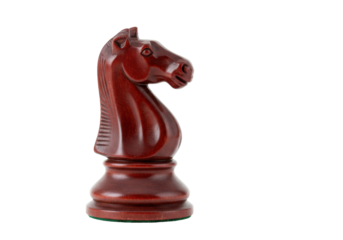Wooden chess knight piece isolated, dark brown horse head figurine on transparent background, strategy game element