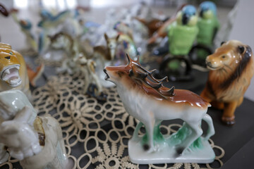 Shallow depth of field (selective focus) details with Romanian communist era ceramic trinkets (bibelouri).