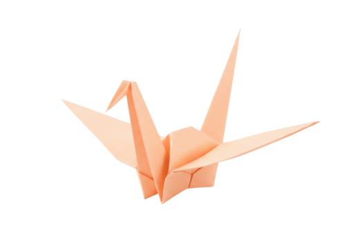 Peach origami crane isolated on transparent background, traditional Japanese folded paper art for peace and good luck