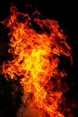 Close up burning flames on black background for graphic design or wallpaper.