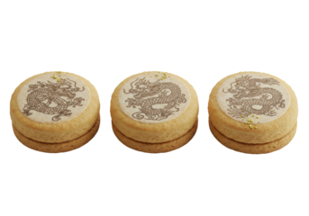 Three elegant golden-brown shortbread cookies with intricate dark dragon designs and edible gold dust, in a row on a clean transparent background, concept for high-end gourmet food advertising