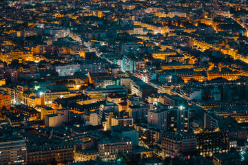 Obraz premium Aerial Night View of Paris City Lights and Rooftops