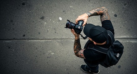 Male with Tattoos Capturing Shot on Dark Street