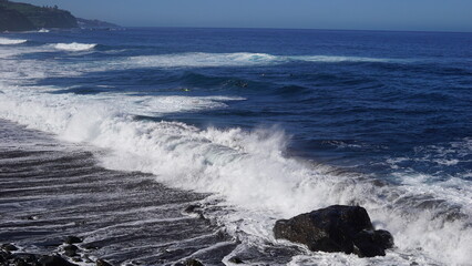 Tenerife landscapes, picturesque coastline, powerful ocean waves at sunset, Canary Islands