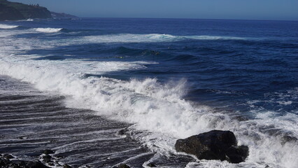 Tenerife landscapes, picturesque coastline, powerful ocean waves at sunset, Canary Islands