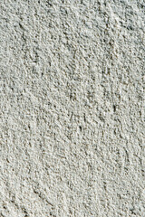 Fototapeta premium Close-up of rough white stucco wall texture