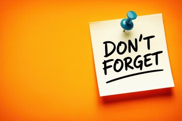 A bright orange background with a yellow sticky note and a blue push pin, featuring the handwritten reminder 'Don't Forget' for important tasks and appointments