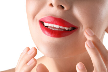 Obraz premium Woman with beautiful red lipstick on her lips against white background, closeup
