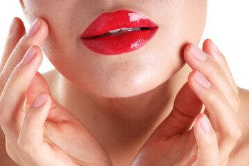 Naklejka premium Woman with beautiful red lipstick on her lips against white background, closeup