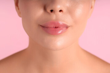 Obraz premium Woman with beautiful lips on pink background, macro view
