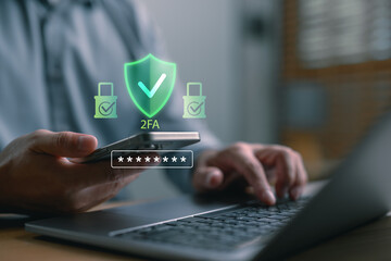 User enabling two-factor authentication (2FA) using smartphone and laptop for secure login. Cybersecurity concept with digital password protection and identity verification technology.