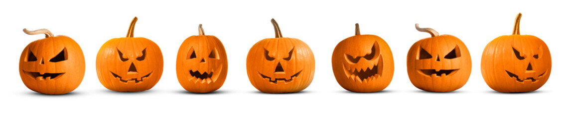 Pumpkins with spooky carved faces on white background. Halloween decoration