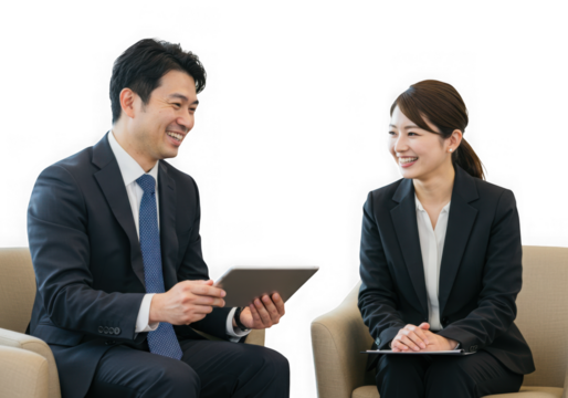 Asian business colleagues in a meeting looking at a tablet isolated on transparent background