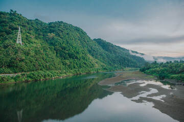 Bato River Landscape with Power Pylon and Low Water Level in Bato, Catanduanes, Bicol, Philippines