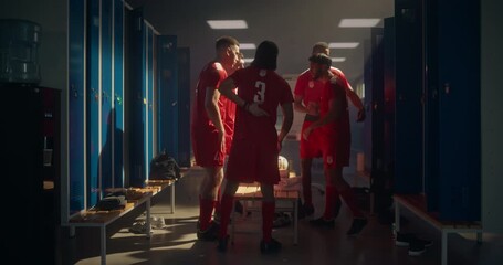 Football Players Form a Motivational Circle, Standing Shoulder to Shoulder, Holding Hands Together, Chanting and Cheering. Locker Room Fills with Team Spirit, Confidence and Brotherhood - Powered by Adobe